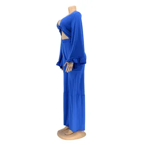 Vibrant blue two-piece set featuring a bell sleeve crop top and matching wide-leg pants