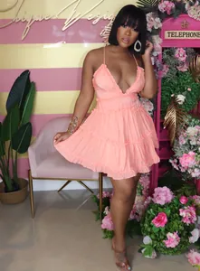 Model wearing sexy sleeveless backless ruffled mini baby doll dress in peach pink