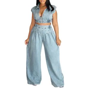 Sexy two-piece light wash denim set featuring sleeveless crop top and wide-leg pants