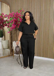 Women's black two-piece linen lounge set with short sleeve shirt and wide-leg pants