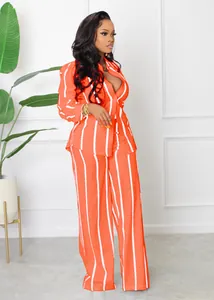 Stylish orange and white striped long sleeve shirt and wide-leg trousers set for women