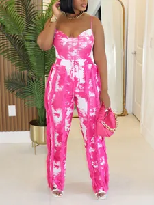 Detailed close-up of pink tie-dye summer two-piece outfit featuring side fringe tassels