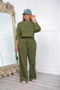 Full body view of women's olive green two-piece cropped sweatshirt and wide-leg sweatpants set