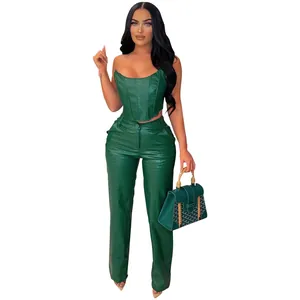 Close-up of green crocodile embossed faux leather strapless corset and matching pants.