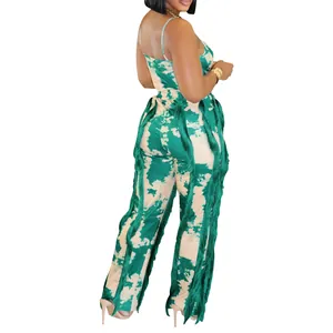 Stylish summer two-piece outfit featuring green tie-dye print and vertical fringe detail