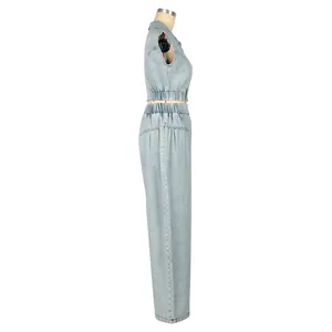 Side view of two-piece light blue denim set with sleeveless crop top and wide leg pants