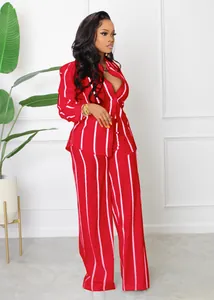Full view of women's red and white vertical striped shirt and wide-leg trousers set