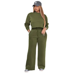 Close-up of olive green casual two-piece sweatshirt and wide-leg sweatpants set on model.