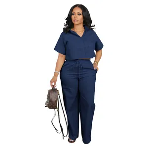 Detail view of navy blue two-piece linen shirt and wide-leg trousers set