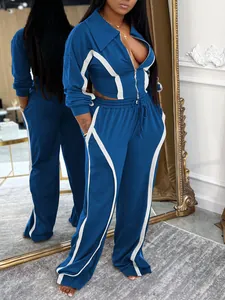 Close-up of blue and white two-piece tracksuit with zip-up jacket and wide-leg pants