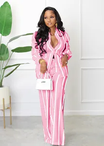 Full view of women's pink striped two-piece outfit featuring long sleeve shirt and wide pants