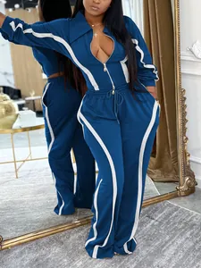 Detailed macro view of the navy blue and white striped two-piece women's tracksuit