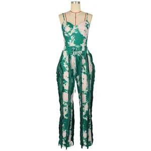 Detailed front view of a stylish green tie-dye two-piece set featuring long side fringes