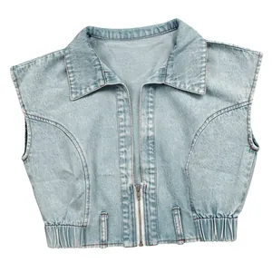 Detail view of vintage light blue cropped denim vest with front zipper and elastic hem