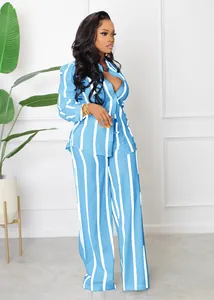 Detailed view of women's blue and white striped long sleeve shirt and wide leg pants set