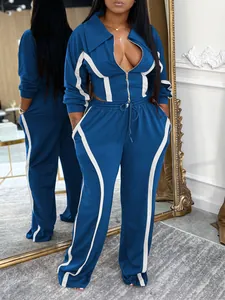 Detail of blue two-piece tracksuit set with white stripes in a mirror reflection