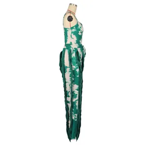 Side view detail of vibrant green tie-dye two-piece set featuring long fringe tassels