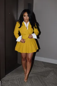 Sophisticated yellow blazer and pleated mini skirt two-piece set for chic office wear