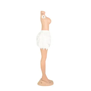 Side detail view showing the lush texture of a white turkey feather mini skirt for parties