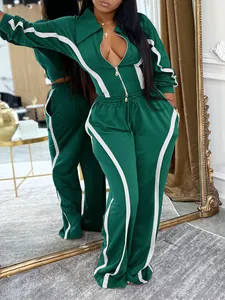 Women's two-piece emerald green tracksuit set with white side stripes detail
