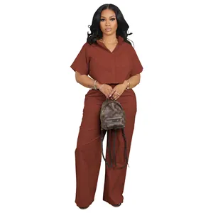 Full view of a casual women's brown two-piece linen set with short-sleeve shirt and wide pants