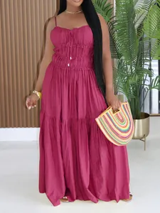 Elegant bohemian sleeveless tiered maxi dress in dark magenta with spaghetti straps