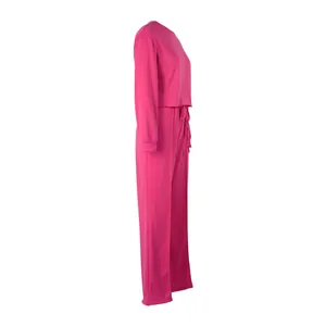 Side view of a pink women's long-sleeve sweatshirt and matching casual pants set.