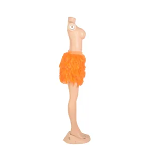 Detailed side profile view of vibrant orange turkey feather mini skirt for party wear