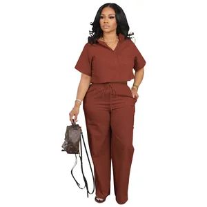 Detailed view of women's brick red linen two-piece set with short sleeve shirt and pants