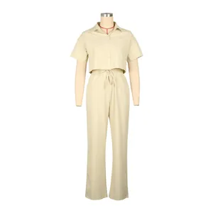 Detailed front view of a beige linen two-piece set featuring a short-sleeved shirt and pants.