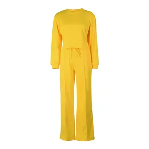 Vibrant yellow women's two-piece lounge set with cropped sweatshirt and wide-leg pants