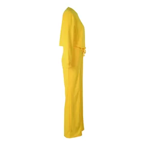 Side profile detail of bright yellow long-sleeve sweatshirt and matching wide-leg pants set