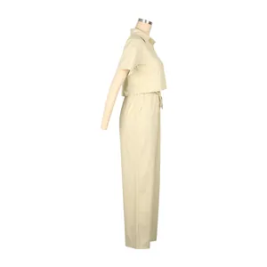 Side view of elegant beige linen two-piece set featuring short sleeve shirt and pants