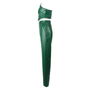 Side view of green faux leather two-piece set with embossed crocodile texture.