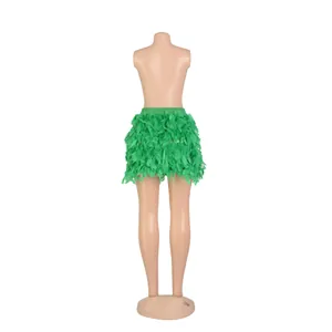 Back view of a vibrant green turkey feather mini skirt displayed on a professional mannequin