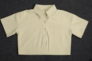 Detailed view of women's cream short sleeve linen button-down shirt with chest pocket