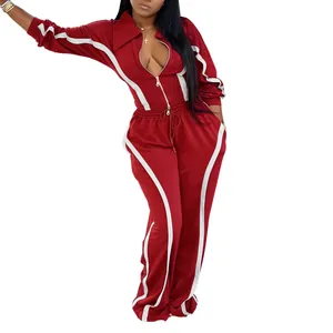 Red and white two-piece women's tracksuit set with zip-up jacket and wide-leg pants