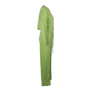Side profile of a vibrant lime green two-piece sweatshirt and wide-leg pants set