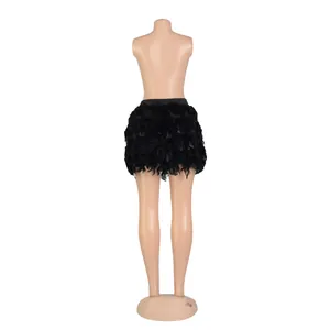 Back view of a black turkey feather mini skirt on a mannequin for party outfits