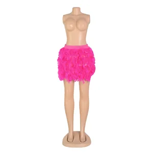 Detailed view showing the lush texture of a hot pink turkey feather mini skirt for party wear