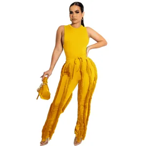 Felgeel tweedelig setje met mouwloze top en modieuze broek met franjes detail