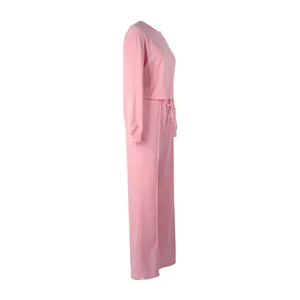 Side view of a pink two-piece tracksuit set with sweatshirt and wide-leg pants