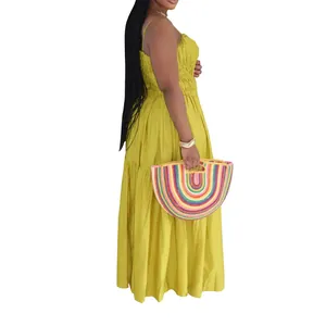 Vibrant bohemian yellow tiered maxi dress with spaghetti straps and sleeveless design
