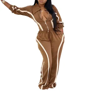 Women's brown two-piece tracksuit with contrast white stripe detailing and zip-up jacket