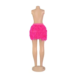 Detailed back view of a vibrant fuchsia pink turkey feather mini skirt for party wear.