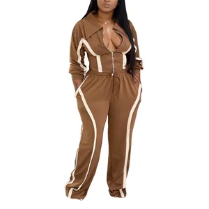 Detailed view of women's brown and white two-piece cotton tracksuit with zip jacket
