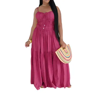 Detailed view of a bohemian tiered sleeveless maxi dress featuring vibrant plum purple fabric