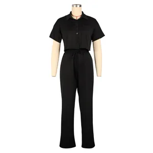 Full view of black short sleeve crop shirt and matching high waist wide leg trousers on mannequin