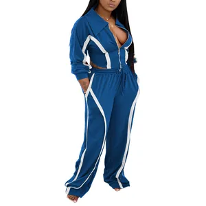 Two-piece blue sports tracksuit with white stripe details and zip-up jacket