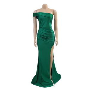 Detailed view of elegant green one-shoulder evening gown with thigh-high slit and pleats